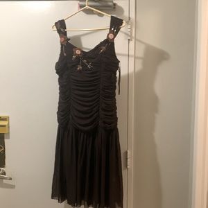 Vintage chocolate brown dress with pink floral details.